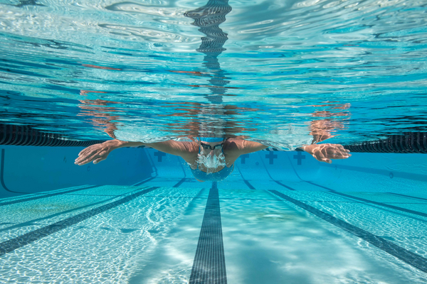 The Multifaceted Scientific Benefits of Competitive Swimming