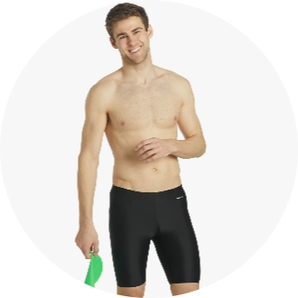 A male model is wearing black swim jammers, holding green swim paddles in his hand. The swimwear is designed for competitive swimming, offering a sleek and comfortable fit.