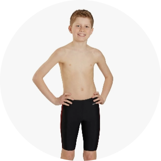 Boy wearing black and red jammers, posing confidently with hands on hips. Ideal swimwear for competitive swimming and training sessions.